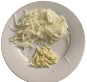 sliced onions and garlic on a white plate