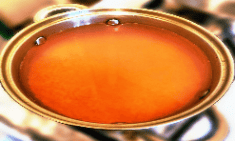 red lentils rinsed and soaked in a pot full of water